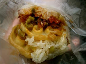 2 RMB.  Rice with assorted fillings :)